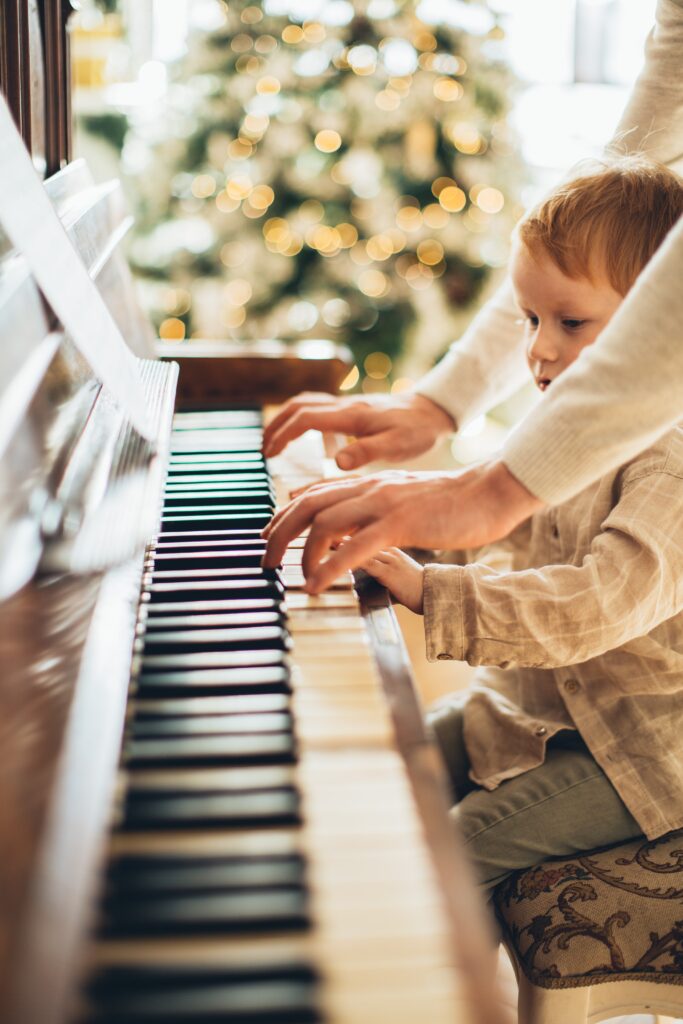 teaching piano to a child